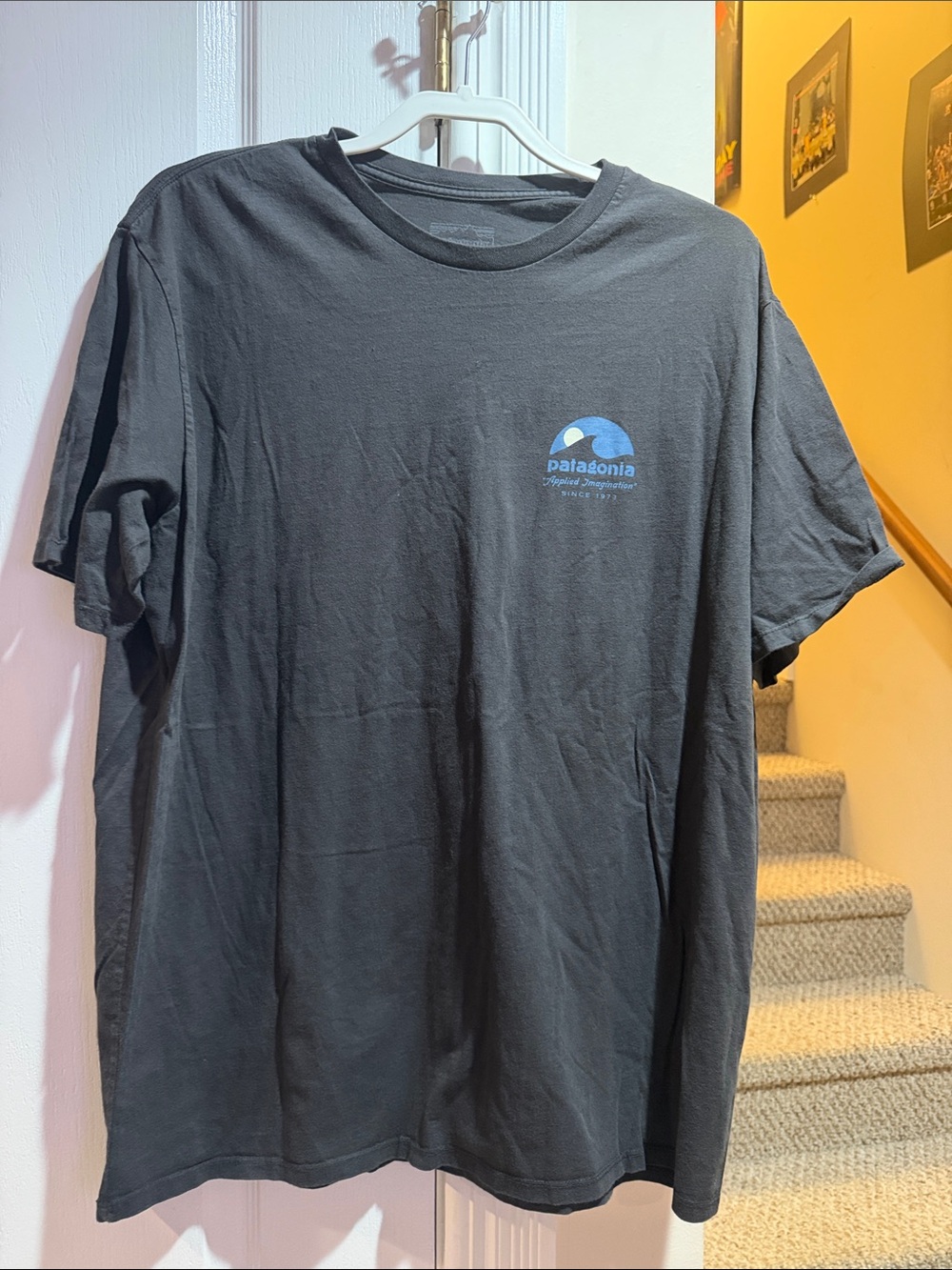 Menโs XL Patagonia Black Short-Sleeve Tee with Blue Logo